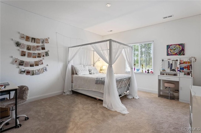 bedroom featuring carpet floors, visible vents, and baseboards