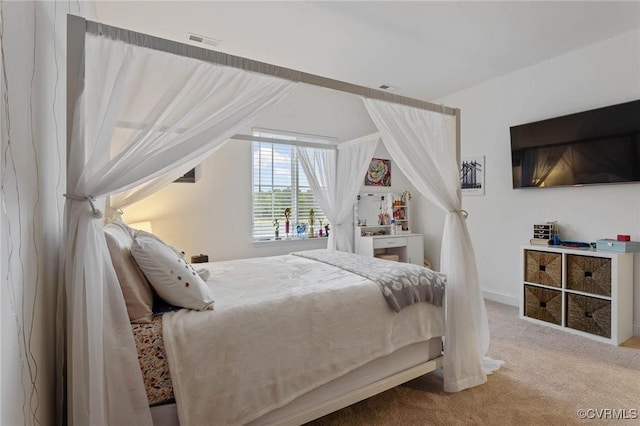 carpeted bedroom with visible vents