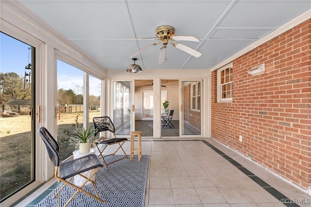 sunroom / solarium with ceiling fan