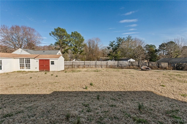 view of yard with a fenced backyard