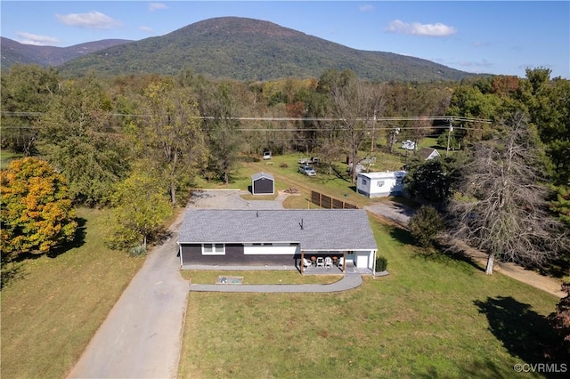 aerial view featuring a mountain view and a view of trees