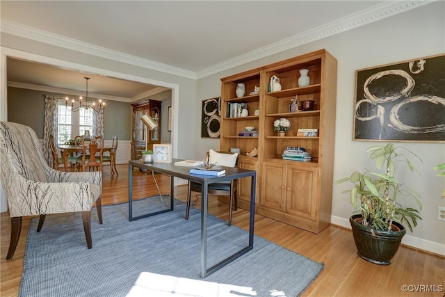 office area featuring crown molding, light wood-type flooring, and a notable chandelier