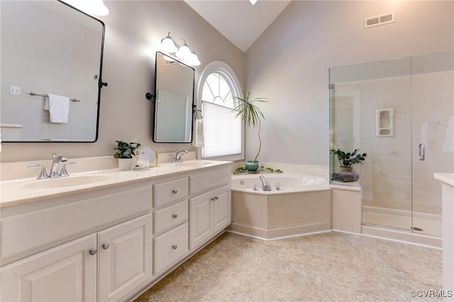 bathroom featuring a stall shower, visible vents, lofted ceiling, a bath, and a sink