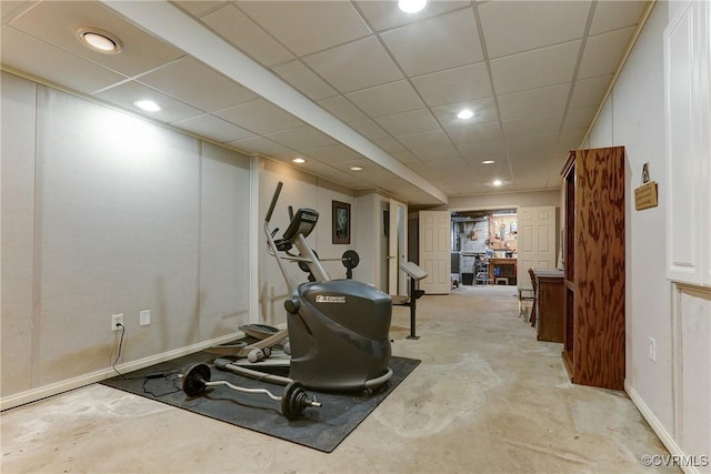 exercise room with a drop ceiling and recessed lighting