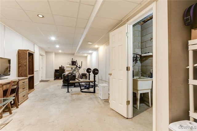 finished basement featuring a drop ceiling and recessed lighting