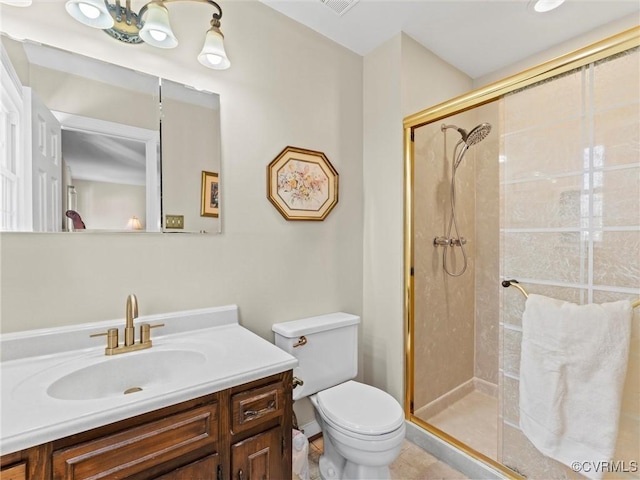 full bathroom with a shower stall, toilet, and vanity