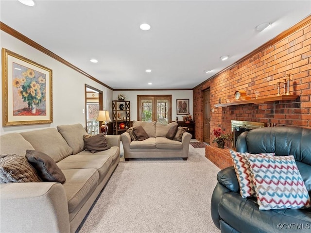 carpeted living room featuring recessed lighting, brick wall, a fireplace, french doors, and crown molding