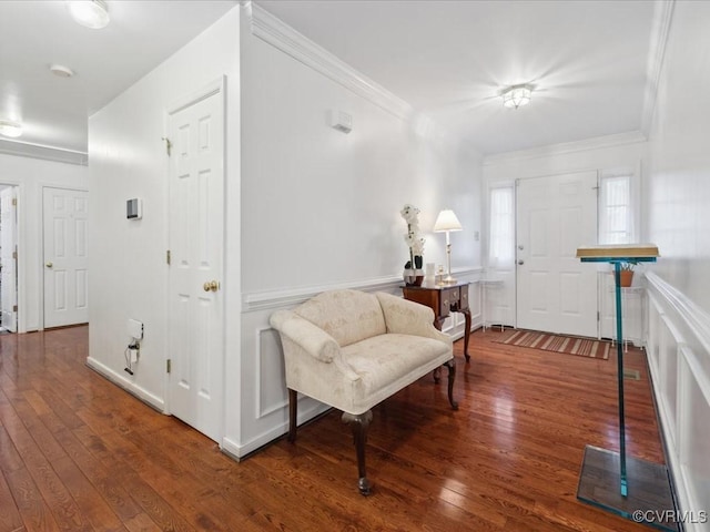 foyer featuring hardwood / wood-style flooring and crown molding