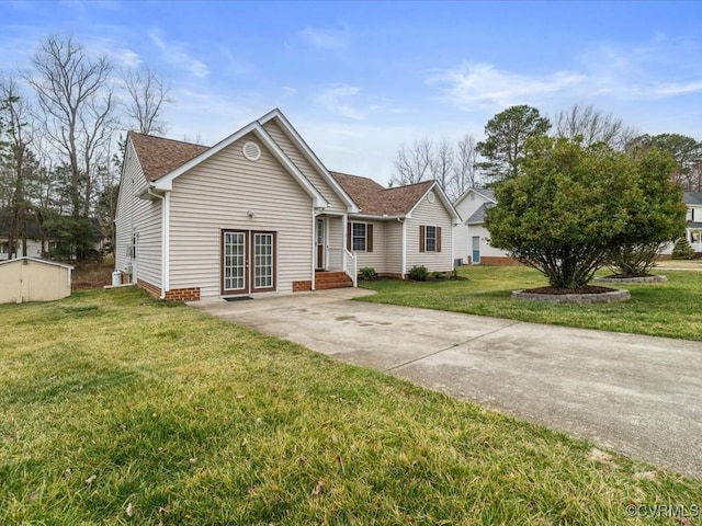 single story home featuring french doors and a front yard