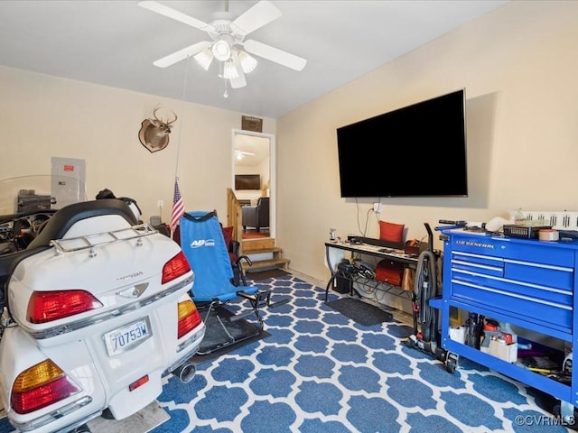 playroom featuring a ceiling fan and electric panel