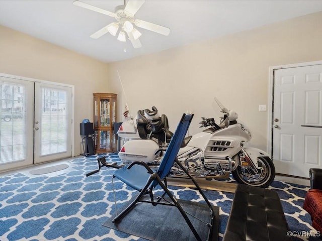 workout room featuring a ceiling fan and carpet flooring