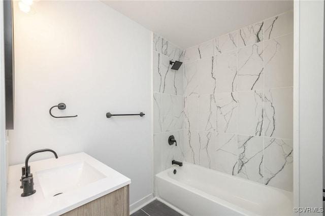 bathroom featuring  shower combination and vanity