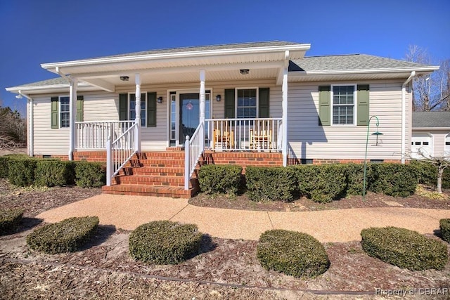 view of front of property featuring a porch, crawl space, and a shingled roof