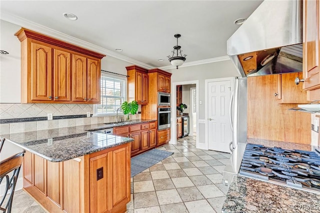 kitchen featuring ventilation hood, a peninsula, a sink, stainless steel appliances, and backsplash