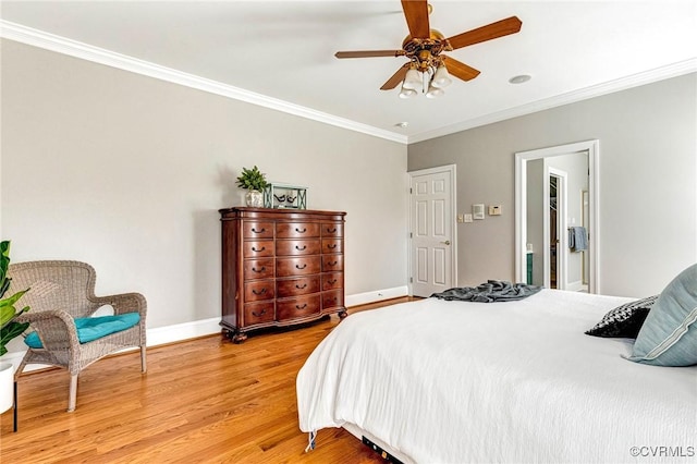 bedroom featuring baseboards, light wood-style floors, ceiling fan, and crown molding