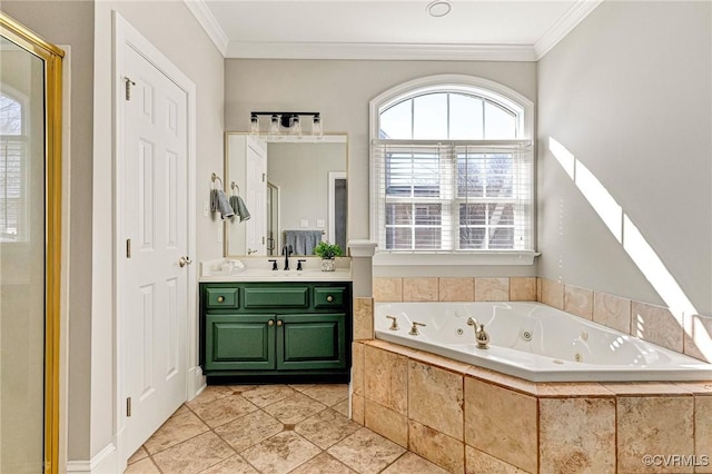 full bathroom featuring vanity, a whirlpool tub, and crown molding