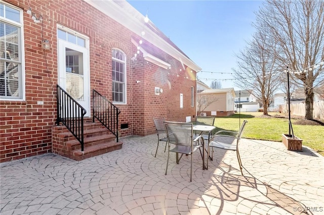 view of patio featuring a residential view, outdoor dining space, and entry steps