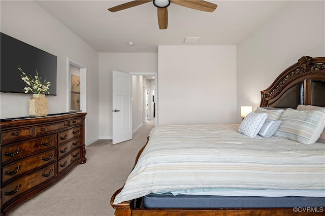 bedroom featuring light carpet, ceiling fan, and baseboards