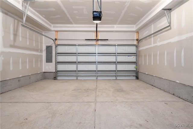 garage featuring electric panel and a garage door opener