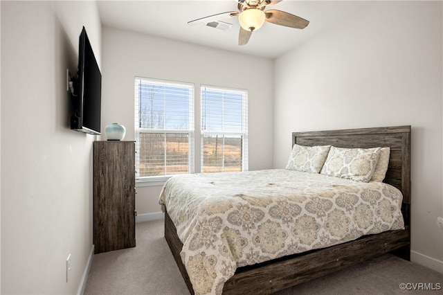 bedroom featuring a ceiling fan, carpet, visible vents, and baseboards