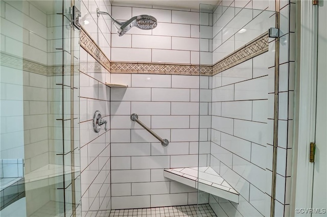 bathroom with a shower stall