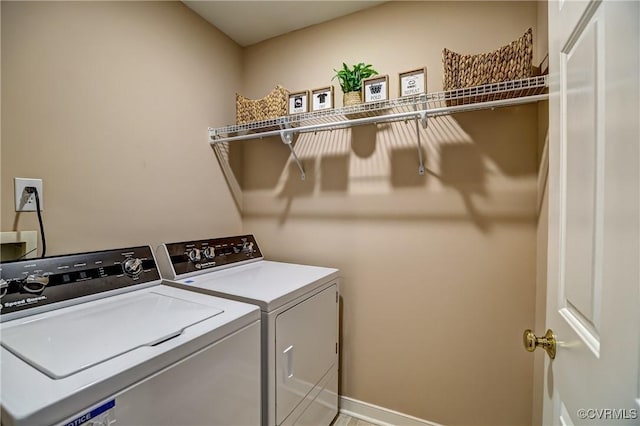 washroom with laundry area and washing machine and clothes dryer