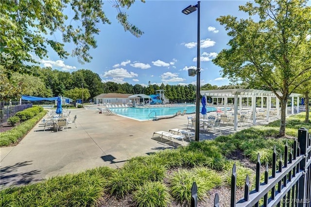 pool featuring a patio area, fence, and a pergola