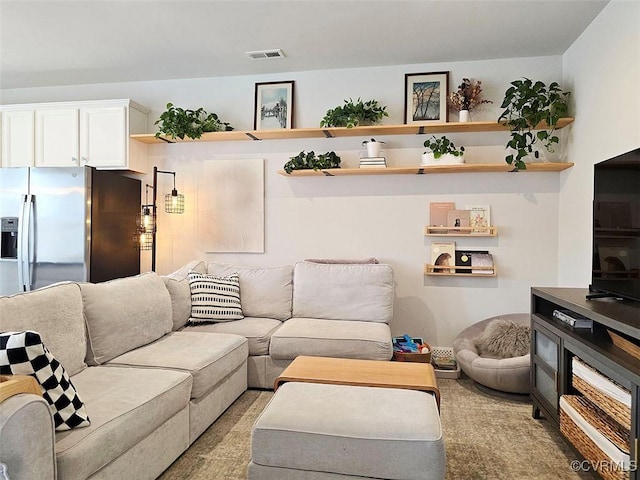 living room featuring visible vents