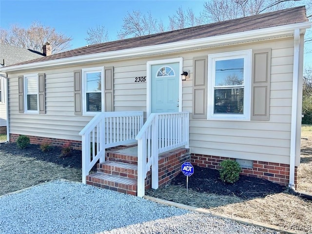 view of front of home featuring crawl space