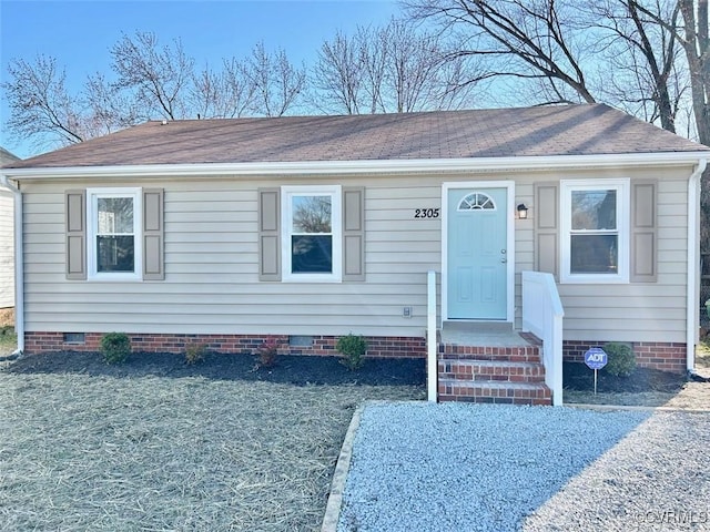 view of front of property featuring roof with shingles and crawl space