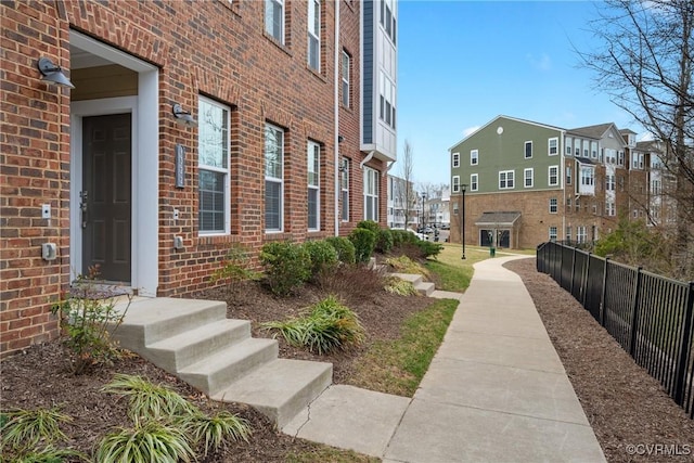 surrounding community featuring a residential view and fence