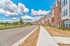 view of street featuring sidewalks and a residential view