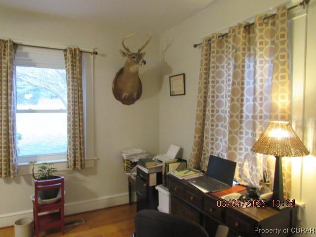 office area featuring wood finished floors and baseboards