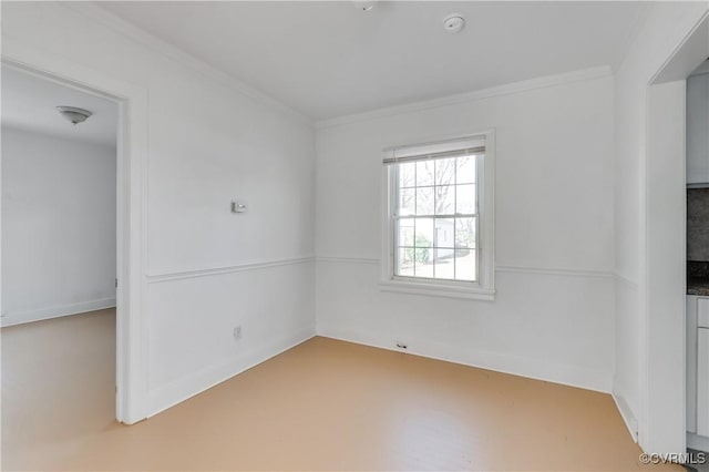 spare room featuring ornamental molding