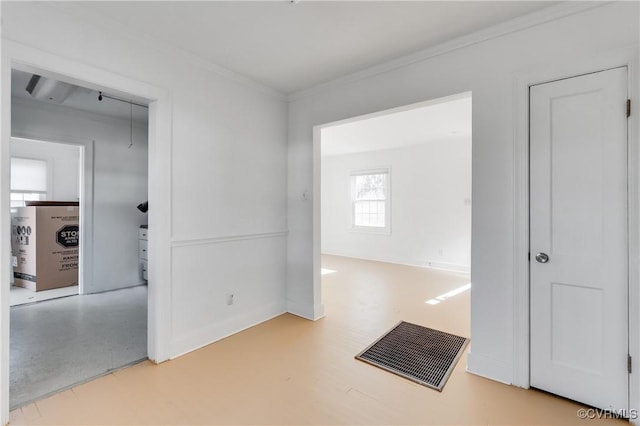 corridor featuring ornamental molding