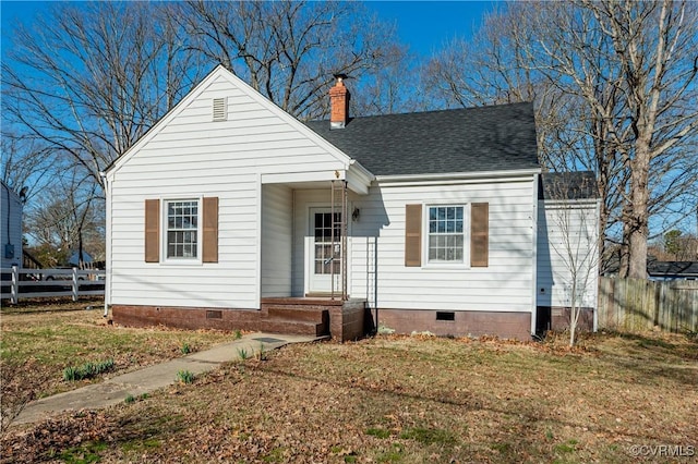 view of front of property with crawl space, a chimney, and fence