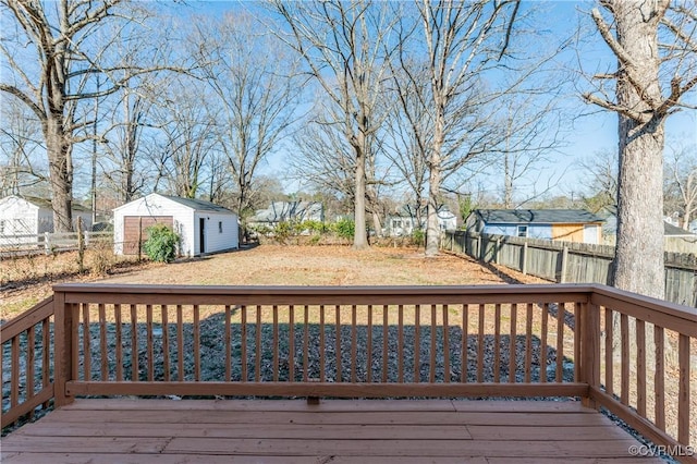 deck with an outdoor structure and fence