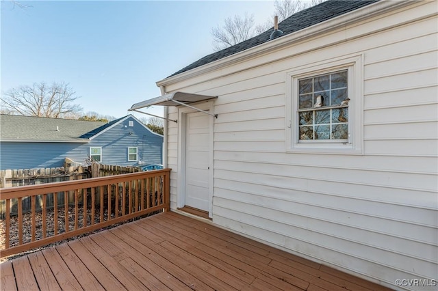 wooden terrace featuring fence