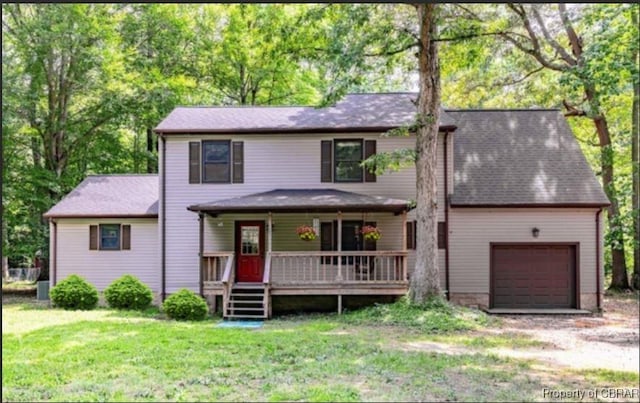 view of front of home featuring a garage and a front yard