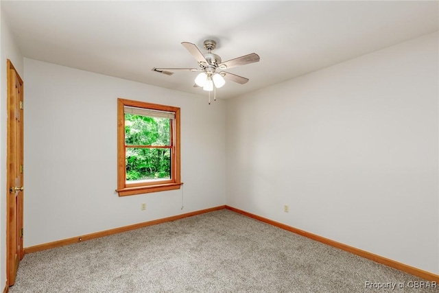 empty room with light carpet, baseboards, and a ceiling fan