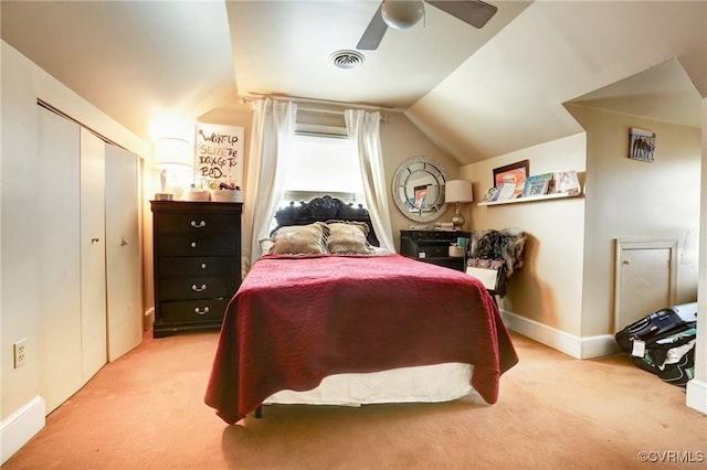 carpeted bedroom with lofted ceiling, visible vents, ceiling fan, and baseboards