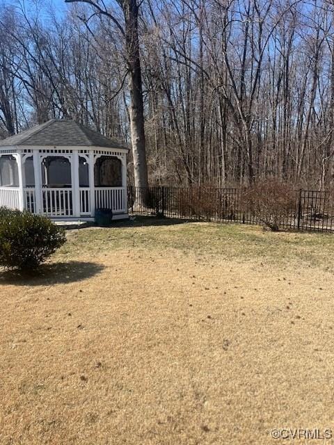 view of yard with a gazebo and fence