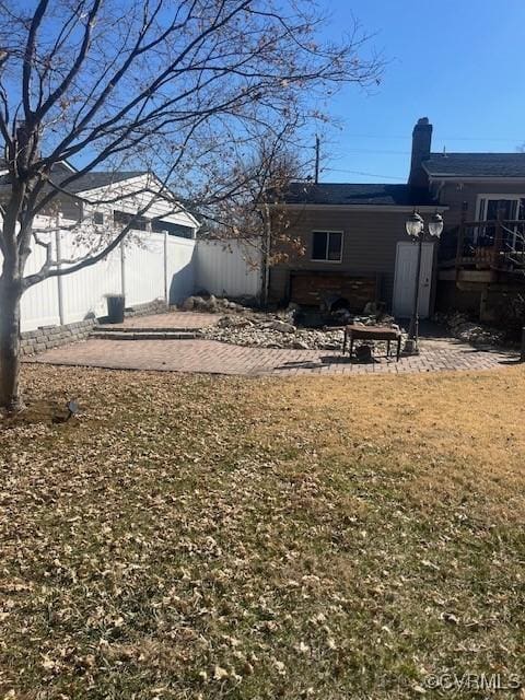 view of yard featuring a patio area and fence