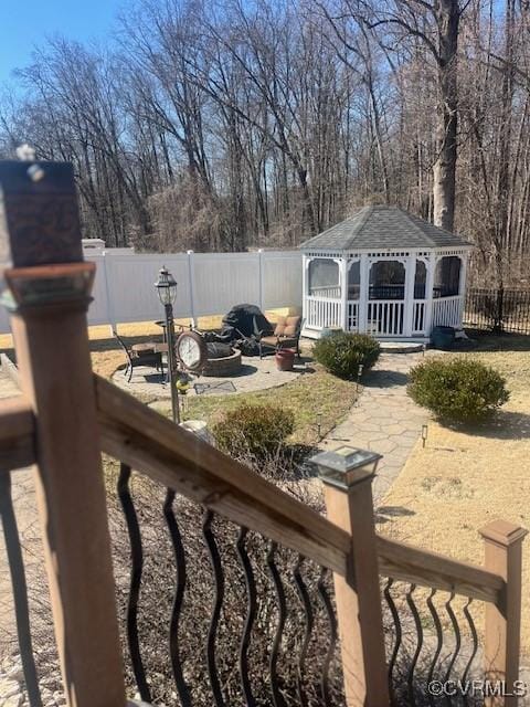 view of yard with a gazebo, a patio, and a fenced backyard