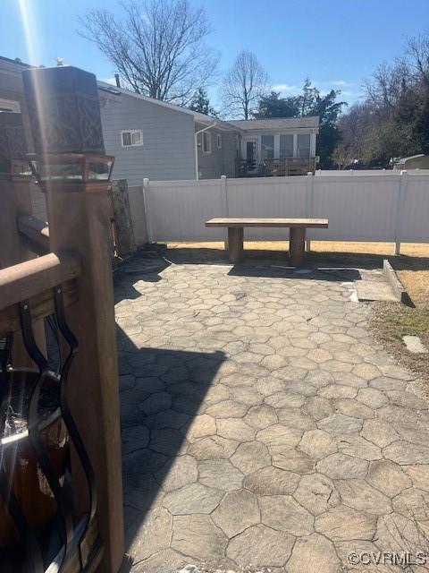 view of patio / terrace featuring fence