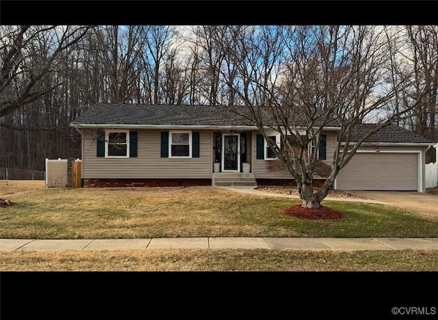 single story home with a garage, a front yard, and driveway