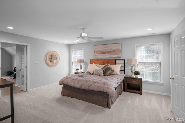 carpeted bedroom featuring ceiling fan, recessed lighting, visible vents, and baseboards