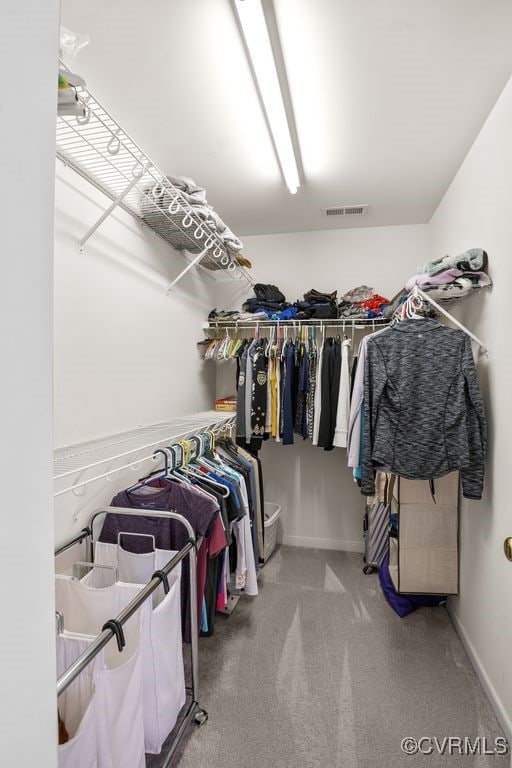 walk in closet with carpet floors and visible vents