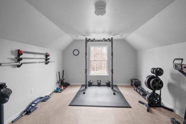 exercise area with vaulted ceiling and baseboards