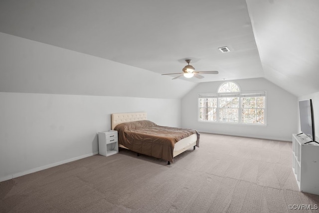 carpeted bedroom featuring vaulted ceiling, ceiling fan, visible vents, and baseboards